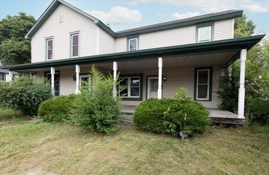 Excellent investment opportunity or ideal owner-occupant duplex! - photo 1