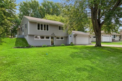 This walkout rambler is nestled on a quiet street with easy - photo 1