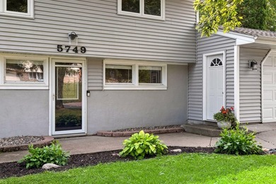 This walkout rambler is nestled on a quiet street with easy - photo 3