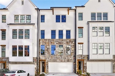 Just one year old and like new, this luxury townhome is located