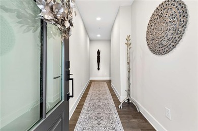 Just one year old and like new, this luxury townhome is located