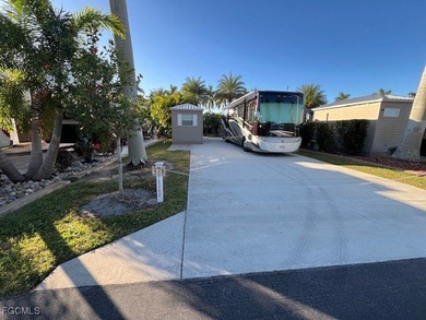 This north facing concrete lot with added pavers on the side - photo 1