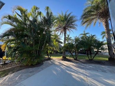 This north facing concrete lot with added pavers on the side - photo 7