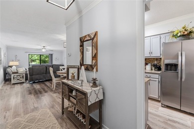 Wake up to lake views and enjoy carefree living in this - photo 3