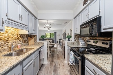 Wake up to lake views and enjoy carefree living in this - photo 5