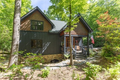 Experience unparalleled mountain living in this charming - photo 1