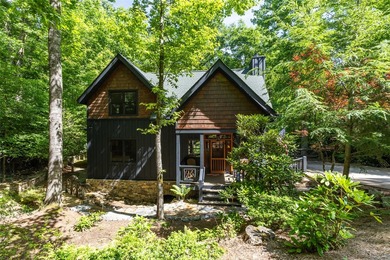Experience unparalleled mountain living in this charming - photo 3