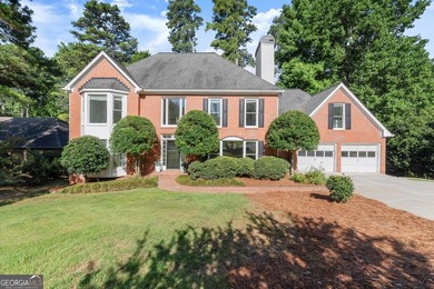 DO NOT MISS this Brick Beauty in coveted Hampton Woods with a - photo 1