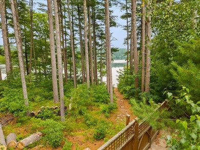Overlooking Tihonet Pond, 22 Red Pine Lane offers a distinctive - photo 2