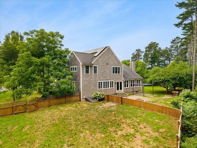 Overlooking Tihonet Pond, 22 Red Pine Lane offers a distinctive - photo 3