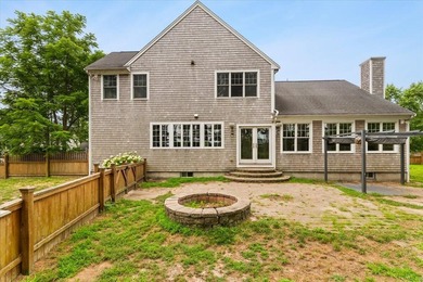 Overlooking Tihonet Pond, 22 Red Pine Lane offers a distinctive - photo 5