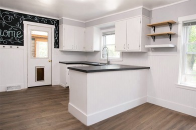 This updated home is move-in ready with fresh flooring, paint - photo 3