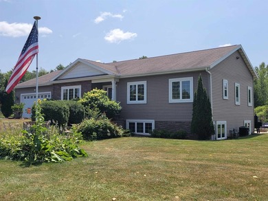 4 bedroom, 2 1/2 bath, 4 car insulated and heated garage on 1.5