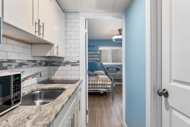 THIS IS IT! Turn key, beach block, 1 bedroom 1 bath condo with 2