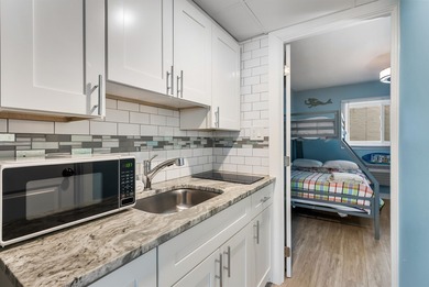 THIS IS IT! Turn key, beach block, 1 bedroom 1 bath condo with 2