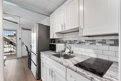 THIS IS IT! Turn key, beach block, 1 bedroom 1 bath condo with 2