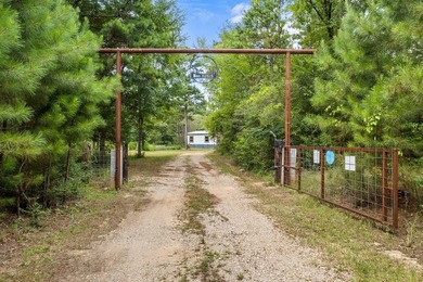 Tucked away among nearly 39 acres of towering timber, this East - photo 1
