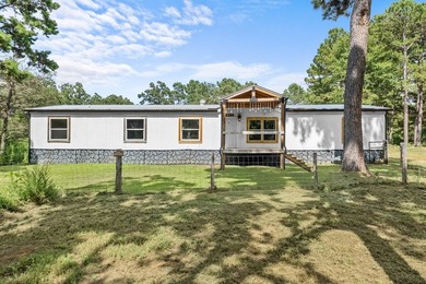 Tucked away among nearly 39 acres of towering timber, this East - photo 2