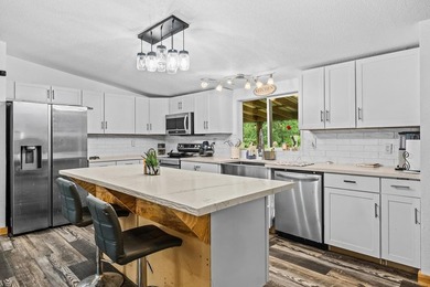 Tucked away among nearly 39 acres of towering timber, this East - photo 8