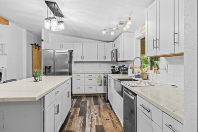 Tucked away among nearly 39 acres of towering timber, this East - photo 9
