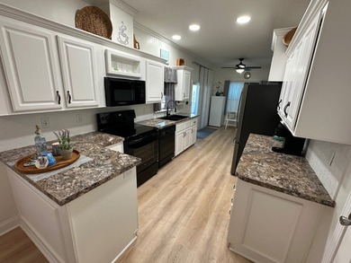 Experience comfort, convenience, and coastal proximity in this - photo 11