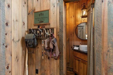 Set on 8.5 pristine acres, this extraordinary custom-built cabin - photo 40