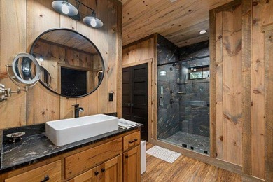Set on 8.5 pristine acres, this extraordinary custom-built cabin - photo 49