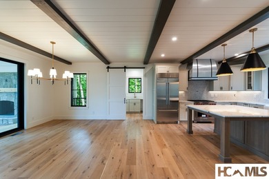 Perched within the gated enclave of Chinquapin, this stunning - photo 9