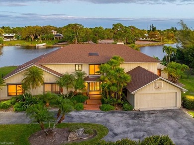 Set behind a curtain of mature landscaping and shimmering water - photo 2