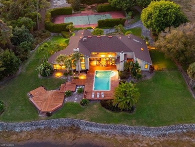 Set behind a curtain of mature landscaping and shimmering water - photo 5