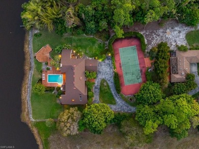 Set behind a curtain of mature landscaping and shimmering water - photo 7