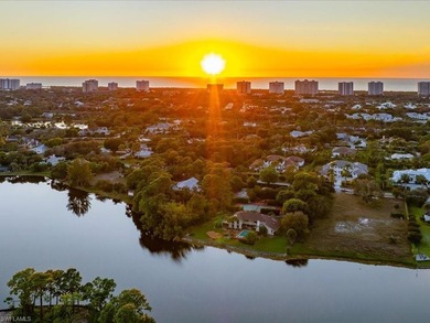 Set behind a curtain of mature landscaping and shimmering water - photo 8