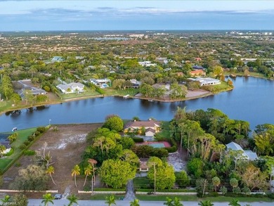 Set behind a curtain of mature landscaping and shimmering water - photo 9