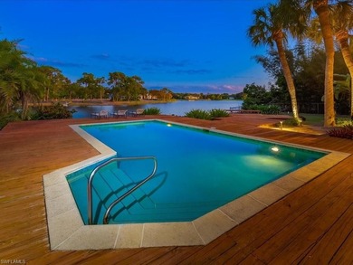 Set behind a curtain of mature landscaping and shimmering water - photo 10