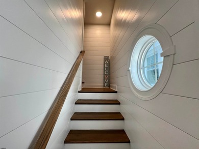 Welcome to this stunning Dean Adams-built beach block 5-bedroom