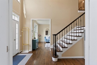 Nestled in the sought-after Pine Hollow neighborhood in the - photo 2