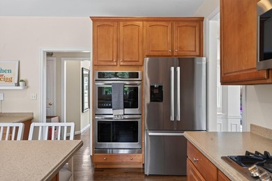 Nestled in the sought-after Pine Hollow neighborhood in the - photo 8
