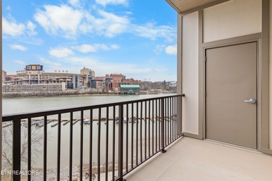 This luxurious waterfront condo overlooks the Tennessee River