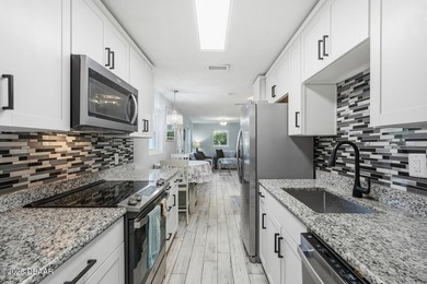This beautifully renovated 3-bedroom concrete block home tucked - photo 30