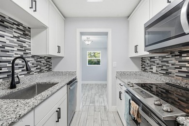 This beautifully renovated 3-bedroom concrete block home tucked - photo 31