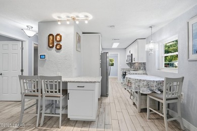 This beautifully renovated 3-bedroom concrete block home tucked - photo 34
