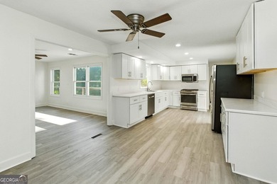 Fully remodeled and move-in ready, this impressive 5-bedroom, 3 - photo 6