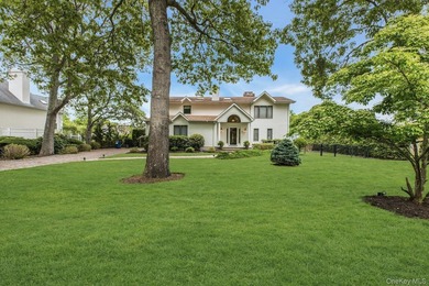 WATERFRONT LIVING AT ITS FINEST Nestled within a private - photo 1