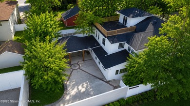 This builder's own home sits proudly atop a hill overlooking - photo 2