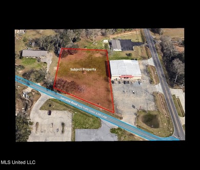 1 acre of commercial land. Mostly cleared. Oak trees. 200+ feet - photo 1