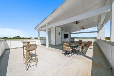 There is a certain energy to this stretch of Inlet Beach, where - photo 4