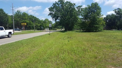 1 acre of commercial land. Mostly cleared. Oak trees. 200+ feet - photo 6