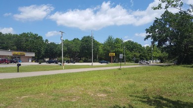 1 acre of commercial land. Mostly cleared. Oak trees. 200+ feet - photo 7