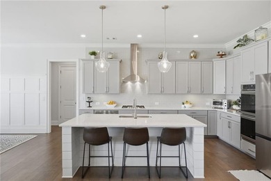 Welcome home to effortless living in one of South Forsyth's most - photo 15