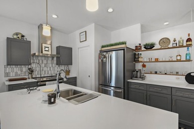 Sunlit, zero-entry living paired with a welcoming front porch - photo 15